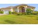 Well-manicured single-Gathering house with a neatly trimmed lawn and a two-car garage at 2522 Pine Valley Dr, Lakeland, FL 33810