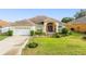 Charming single Gathering home displaying a beautiful lawn and front garden at 2522 Pine Valley Dr, Lakeland, FL 33810