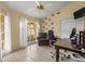 Bright office with large window, ceiling fan, desk, and neutral walls at 2522 Pine Valley Dr, Lakeland, FL 33810