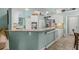 Well-equipped kitchen features granite countertops, breakfast bar, and stainless steel appliances at 2522 Pine Valley Dr, Lakeland, FL 33810