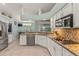 Well-lit kitchen showcases granite countertops, stainless steel appliances, and an adjacent dining area at 2522 Pine Valley Dr, Lakeland, FL 33810