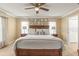Relaxing main bedroom featuring a ceiling fan, neutral-toned walls, and a comfortable bed with decorative pillows at 2522 Pine Valley Dr, Lakeland, FL 33810