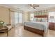 Relaxing main bedroom featuring a ceiling fan, neutral-toned walls, and a comfortable bed with decorative pillows at 2522 Pine Valley Dr, Lakeland, FL 33810