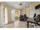 Bright office space with a large window, tile flooring, and comfortable executive chair at 2522 Pine Valley Dr, Lakeland, FL 33810