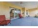 Covered porch with sliding glass door and cushioned seating at 2522 Pine Valley Dr, Lakeland, FL 33810