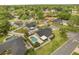 Aerial view of a neighborhood showcasing a home with a private pool and fenced yard at 100 Essex Dr, Longwood, FL 32779
