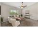 Cozy living room with neutral paint, a ceiling fan, lots of natural light and stylish decor at 100 Essex Dr, Longwood, FL 32779