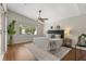 Large bedroom with a ceiling fan, wood floors, decorative rug and lots of natural light at 100 Essex Dr, Longwood, FL 32779