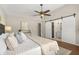 Spacious main bedroom featuring hard wood floors, a ceiling fan, and attached bath at 100 Essex Dr, Longwood, FL 32779