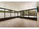 Enclosed sunroom with tile floors, screened windows, and a view of the outdoors at 100 Essex Dr, Longwood, FL 32779