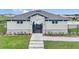 Charming pool house with stone accents, a gated entrance, and nearby landscaping that provides a relaxing atmosphere at 2192 Albatross Nest Dr, Bartow, FL 33830