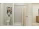 Modern bathroom with sleek tile shower, neutral tones, and stylish fixtures at 2192 Albatross Nest Dr, Bartow, FL 33830