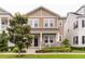 Inviting two-story home with a cozy front porch and lush, green lawn at 7418 Barrier Cove Way, Celebration, FL 34747