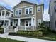 Lovely two-story home with a charming front porch and well-maintained landscaping at 7418 Barrier Cove Way, Celebration, FL 34747