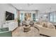 Spacious living room with comfortable seating, stylish decor, and plenty of natural light at 7418 Barrier Cove Way, Celebration, FL 34747