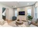 Comfortable living room with contemporary furnishings, stylish décor, and natural light at 7418 Barrier Cove Way, Celebration, FL 34747