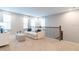 Comfortable loft with seating area and open railing overlooking the lower level at 7418 Barrier Cove Way, Celebration, FL 34747