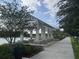 Picturesque lakeside pavilion with open-air seating and scenic views, perfect for outdoor gatherings and relaxation at 7418 Barrier Cove Way, Celebration, FL 34747