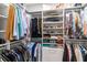 Organized walk-in closet with custom shelving, hanging rods, and compartments for shoes, clothes, and accessories at 7418 Barrier Cove Way, Celebration, FL 34747