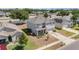 This aerial view shows a home in a quiet suburban neighborhood with green lawns and nearby trees at 5597 Forest Ridge Dr, Winter Haven, FL 33881