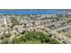 Expansive aerial view of a neighborhood near a beautiful lake with tree lined streets at 5597 Forest Ridge Dr, Winter Haven, FL 33881