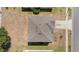 Aerial view of the house showcasing the roof, surroundings, and neighborhood at 5597 Forest Ridge Dr, Winter Haven, FL 33881