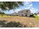 Expansive backyard providing ample space for gardening, recreation, and relaxation at 5597 Forest Ridge Dr, Winter Haven, FL 33881