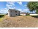 Large backyard featuring a lawn that offers plenty of space for outdoor activities and relaxation at 5597 Forest Ridge Dr, Winter Haven, FL 33881