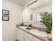 Well-lit bathroom featuring double sinks, and granite countertops, perfect for a busy household at 5597 Forest Ridge Dr, Winter Haven, FL 33881
