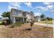 Well-kept home with tidy landscaping, a spacious driveway, and an inviting front porch at 5597 Forest Ridge Dr, Winter Haven, FL 33881