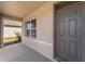 A welcoming front porch with a gray front door and neutral exterior paint, offering curb appeal at 5597 Forest Ridge Dr, Winter Haven, FL 33881