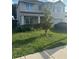 Charming two-story home featuring a well-manicured lawn and inviting curb appeal, great natural light at 5597 Forest Ridge Dr, Winter Haven, FL 33881