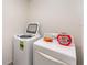 Laundry room with a large washer and dryer, ready for use at 5597 Forest Ridge Dr, Winter Haven, FL 33881