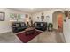 Bright living room features comfortable sofas, and accent tables over plush carpeting at 5597 Forest Ridge Dr, Winter Haven, FL 33881