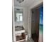 A rundown bathroom featuring an aged vanity and a shower with a blue shower curtain at 10931 Pathfinder Trl, Lakeland, FL 33809