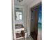 A rundown bathroom featuring an aged vanity and a shower with a blue shower curtain at 10931 Pathfinder Trl, Lakeland, FL 33809