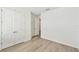 Bright bedroom featuring plank flooring, white trim, and natural light at 16998 Cedar Valley Cir, Clermont, FL 34711