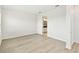 Bright bedroom features light-colored floors and an open door to the bathroom at 16998 Cedar Valley Cir, Clermont, FL 34711
