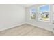 Bright bedroom featuring lots of natural light from two windows at 16998 Cedar Valley Cir, Clermont, FL 34711