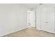 Bedroom featuring plank flooring and access to a double-door closet at 16998 Cedar Valley Cir, Clermont, FL 34711