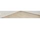 Light wood-look floors with white baseboards in room at 16998 Cedar Valley Cir, Clermont, FL 34711
