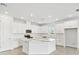 Bright kitchen featuring white cabinets, modern appliances, and a large center island at 16998 Cedar Valley Cir, Clermont, FL 34711