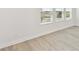 Bright living space with large windows and light-colored modern floors at 16998 Cedar Valley Cir, Clermont, FL 34711