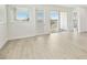 An open living room with bright windows and sliding glass doors to the patio at 16998 Cedar Valley Cir, Clermont, FL 34711