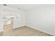 Bright living space with modern flooring and view into the white kitchen area at 16998 Cedar Valley Cir, Clermont, FL 34711