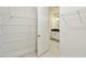 Walk-in closet providing access to a bright bathroom at 16998 Cedar Valley Cir, Clermont, FL 34711