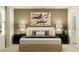 Elegant bedroom with stylish lamps, nightstands, and modern artwork at 4850 Yellow Elder Way, Kissimmee, FL 34758