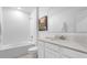 Clean bathroom featuring a vanity, toilet and a shower-tub combination with neutral color tones at 5686 Portico Pl, Kissimmee, FL 34758