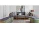 Comfortable living room with stylish seating, contemporary decor, carpet and natural light at 5686 Portico Pl, Kissimmee, FL 34758