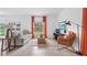 Bright living room with modern furnishings, tile flooring, and a large window with a view at 5686 Portico Pl, Kissimmee, FL 34758